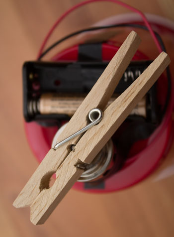 Attach clothespin to motor