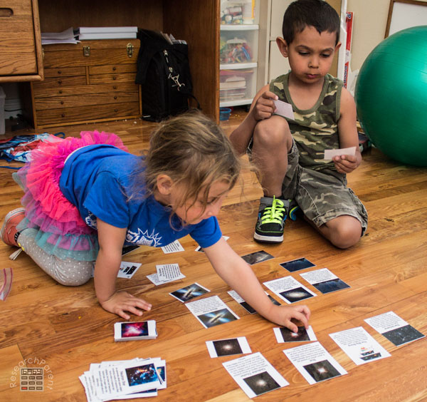 Kids Playing with Universe Cards