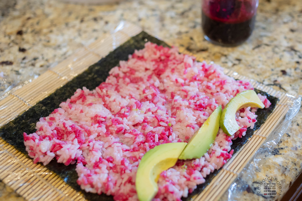 Making pink and green sushi