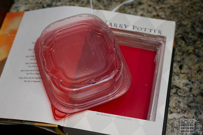 Attach the Container to the Book with Hot Glue