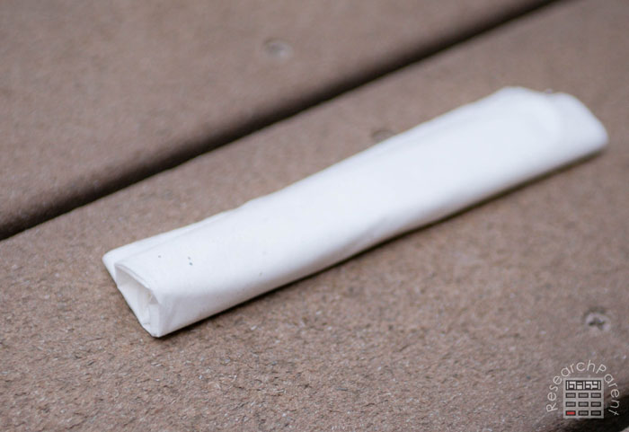 Rolled up baking soda tissue packet